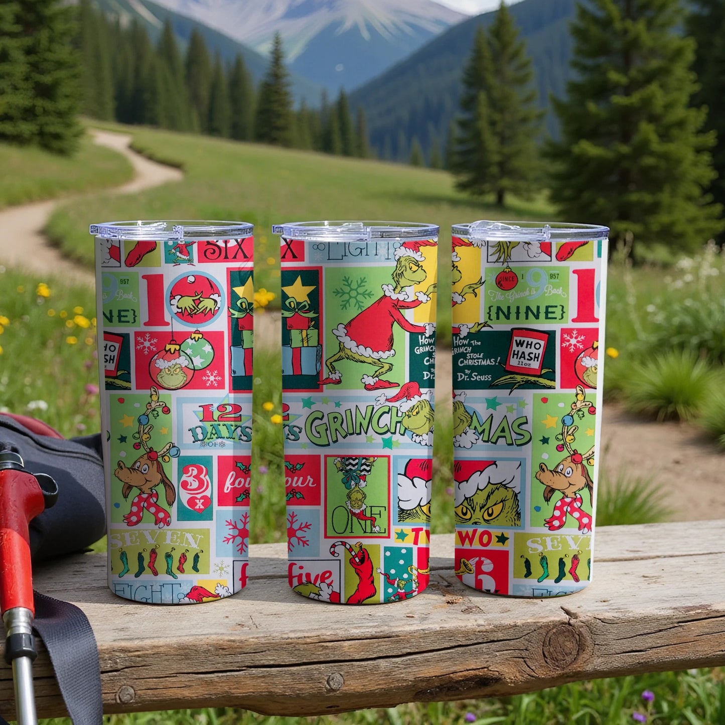 The Grinch themed tumblers featuring Christmas graphics and text.