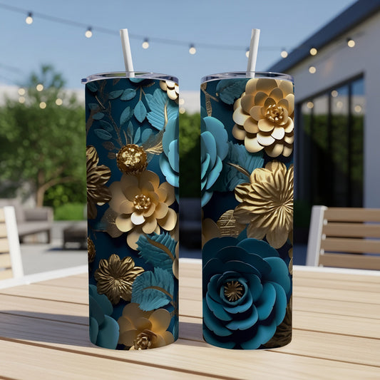 Two tumblers with teal and gold floral patterns on a wooden table outdoors.