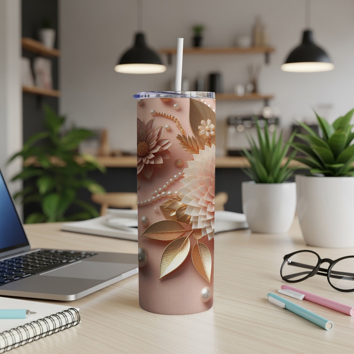 Pink tumbler with floral design and pearl accents.