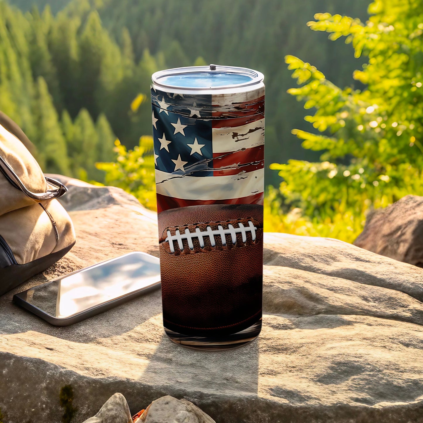 American flag and football design on a tumbler outdoors.