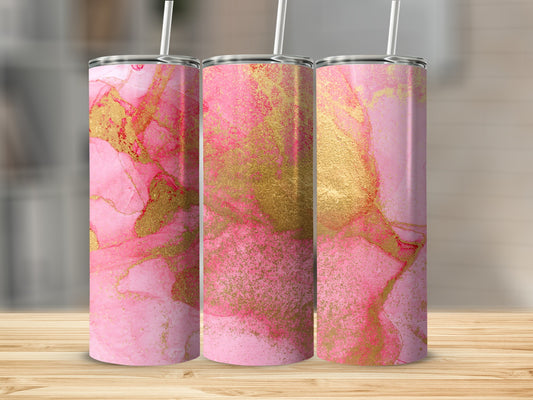 Three pink and gold marbled tumblers on a wooden surface.