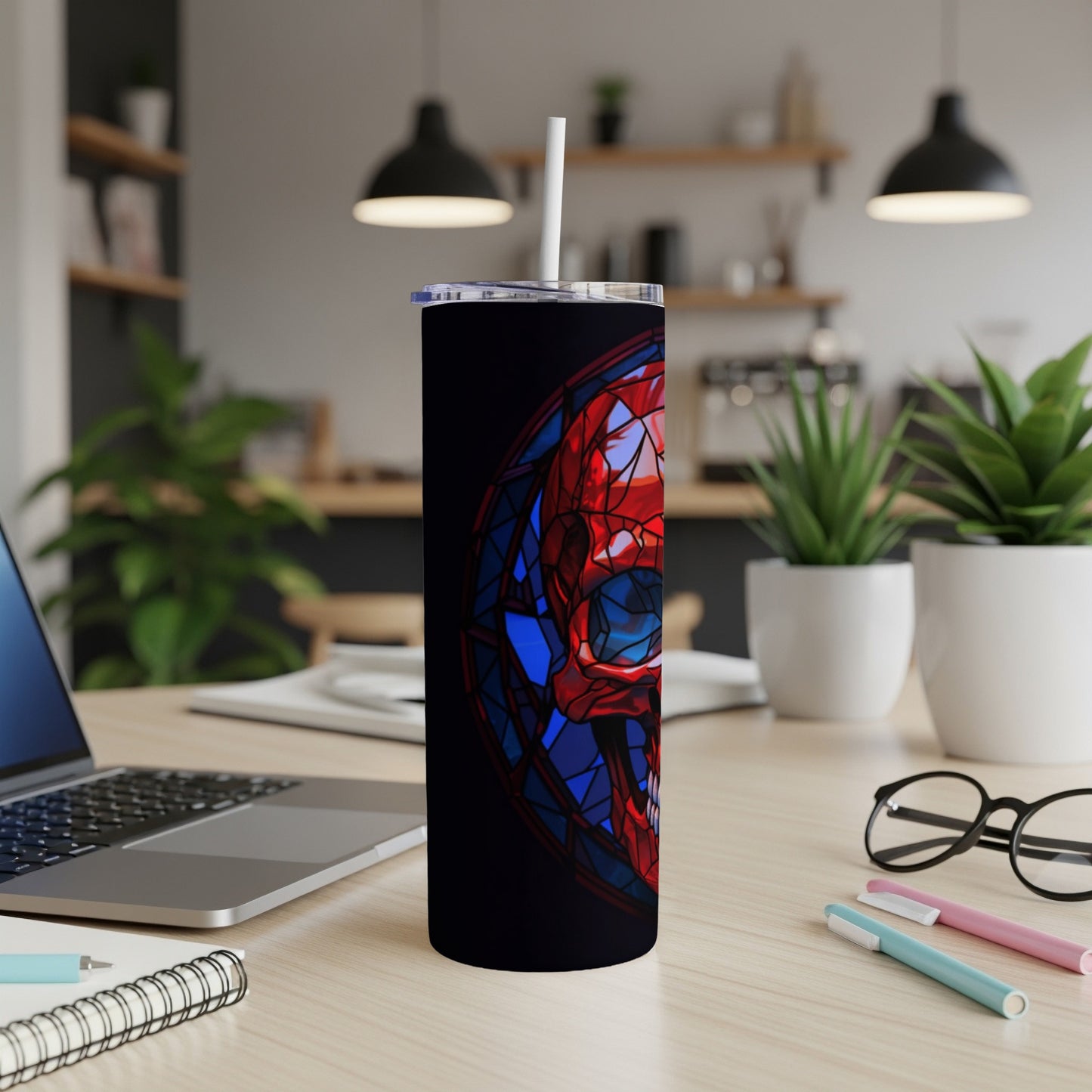 Black tumbler with stained glass skull design.