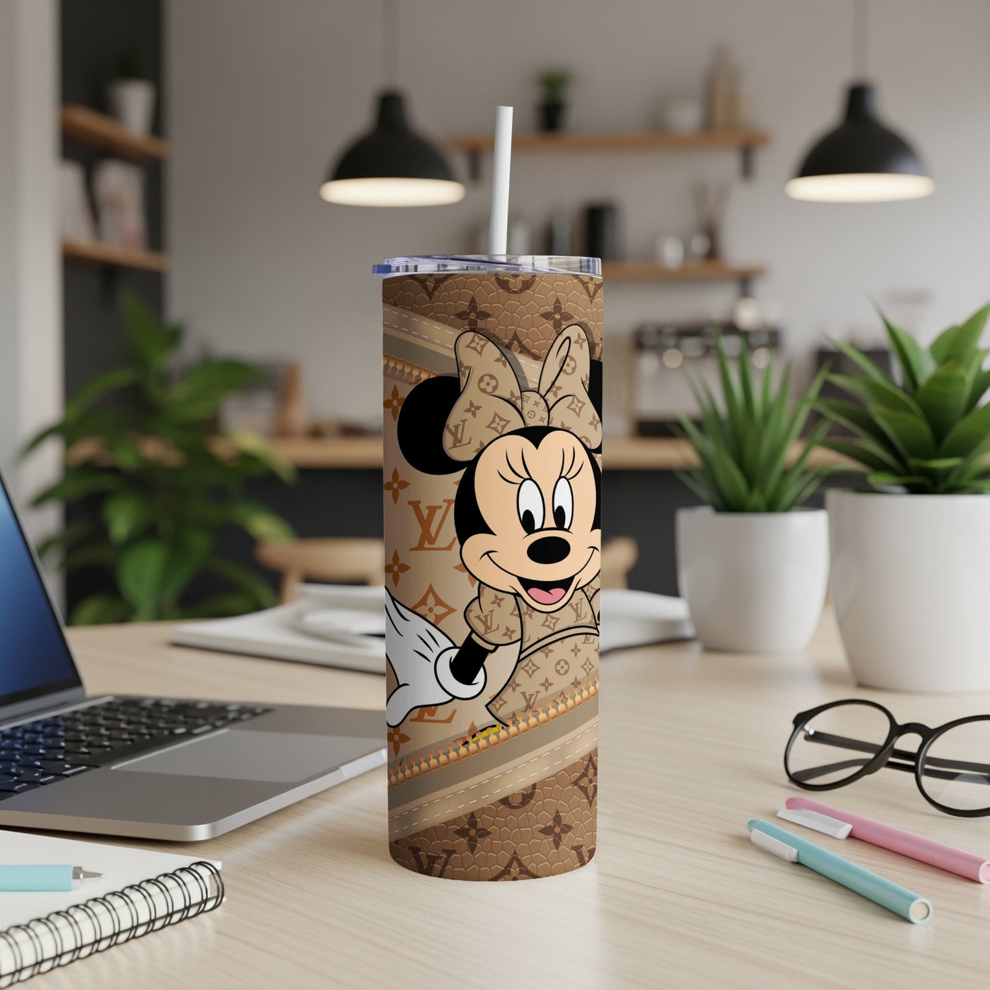 Minnie Mouse tumbler with brown Louis Vuitton pattern and straw.