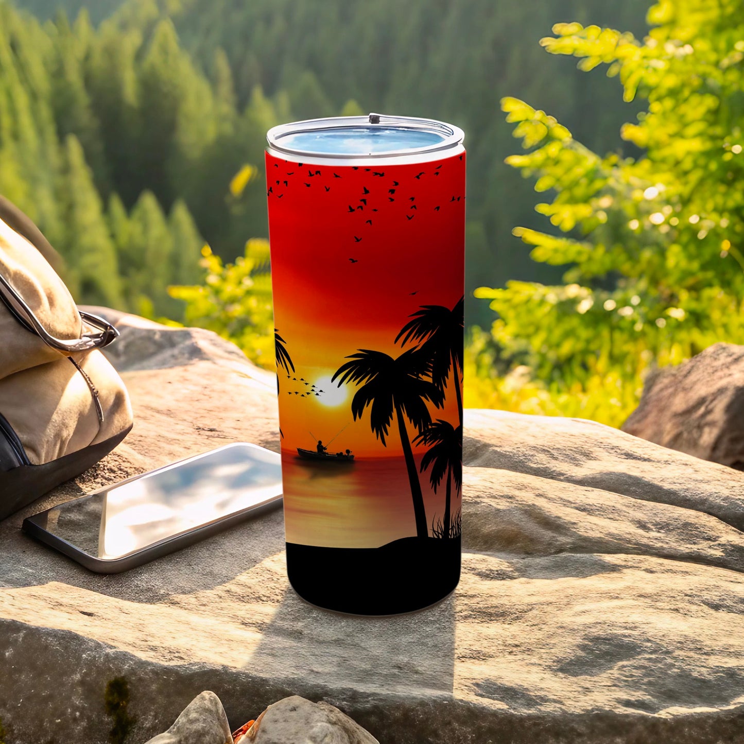 Tumbler with sunset, palm trees, and fishing scene design.