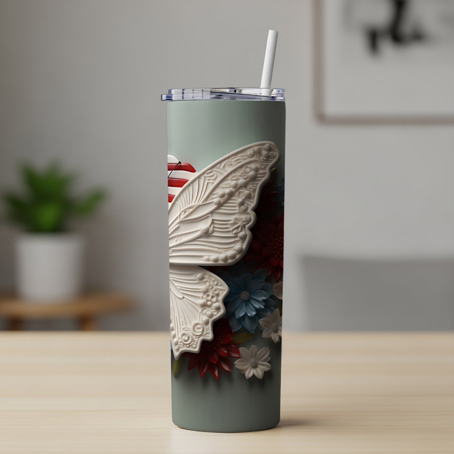 Tall tumbler with embossed white butterfly wing and floral accents.