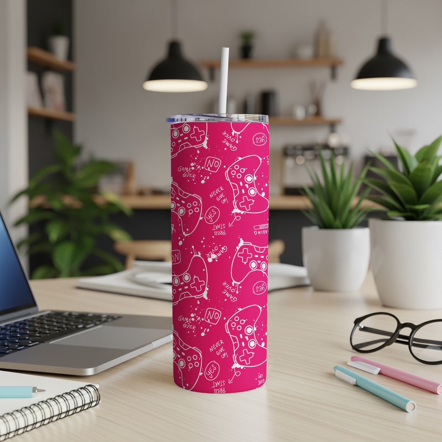 Pink tumbler with white game controllers and "GAME OVER" text.