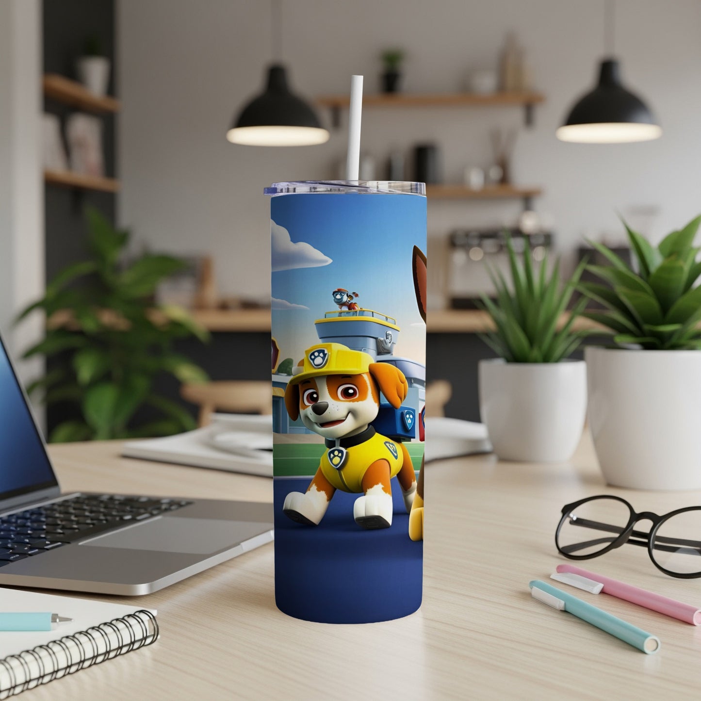Paw Patrol's Ryder on a navy blue tumbler with a cityscape background.