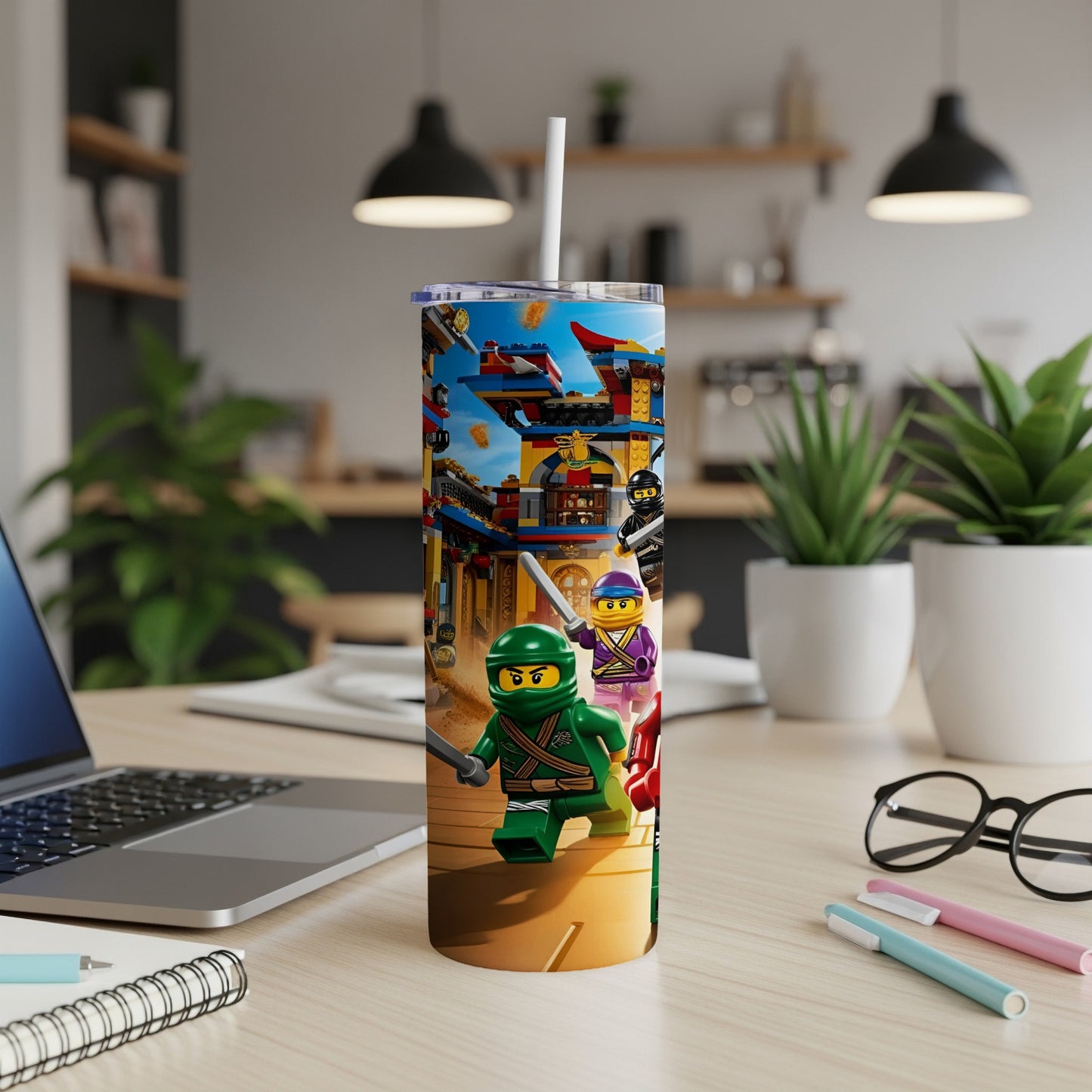 Ninjago characters Kai, Nya, and Zane in action on a colorful tumbler.