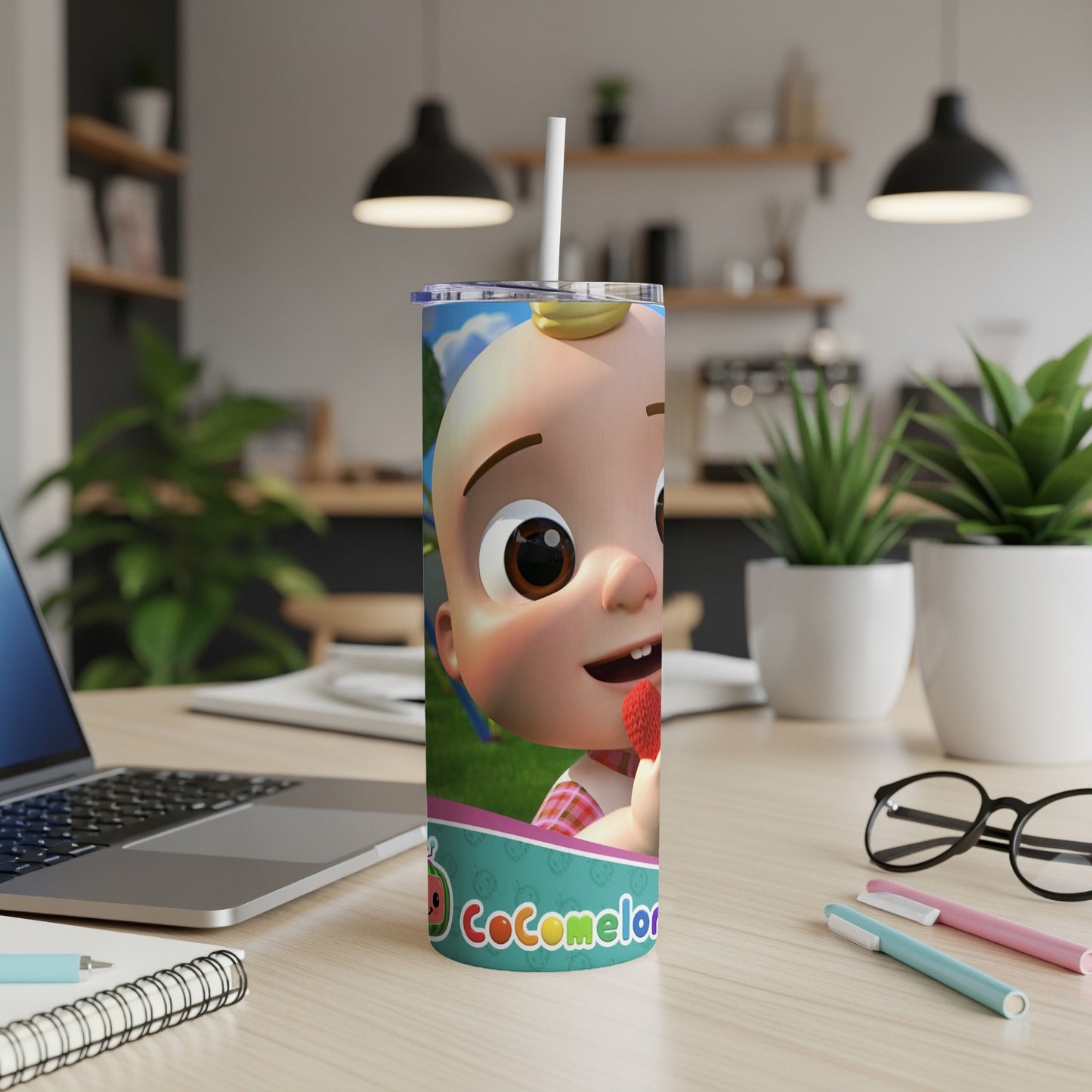 Cocomelon character on a skinny tumbler with a straw.