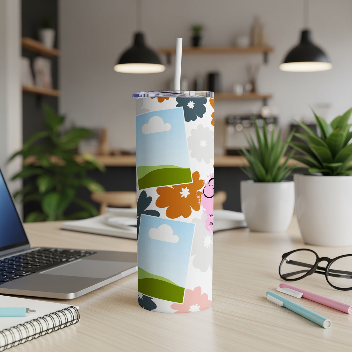 Tumbler with floral pattern, clouds, landscape photos, and text.