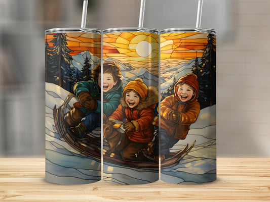 Three children on a sled ride down a snowy hill at sunset.