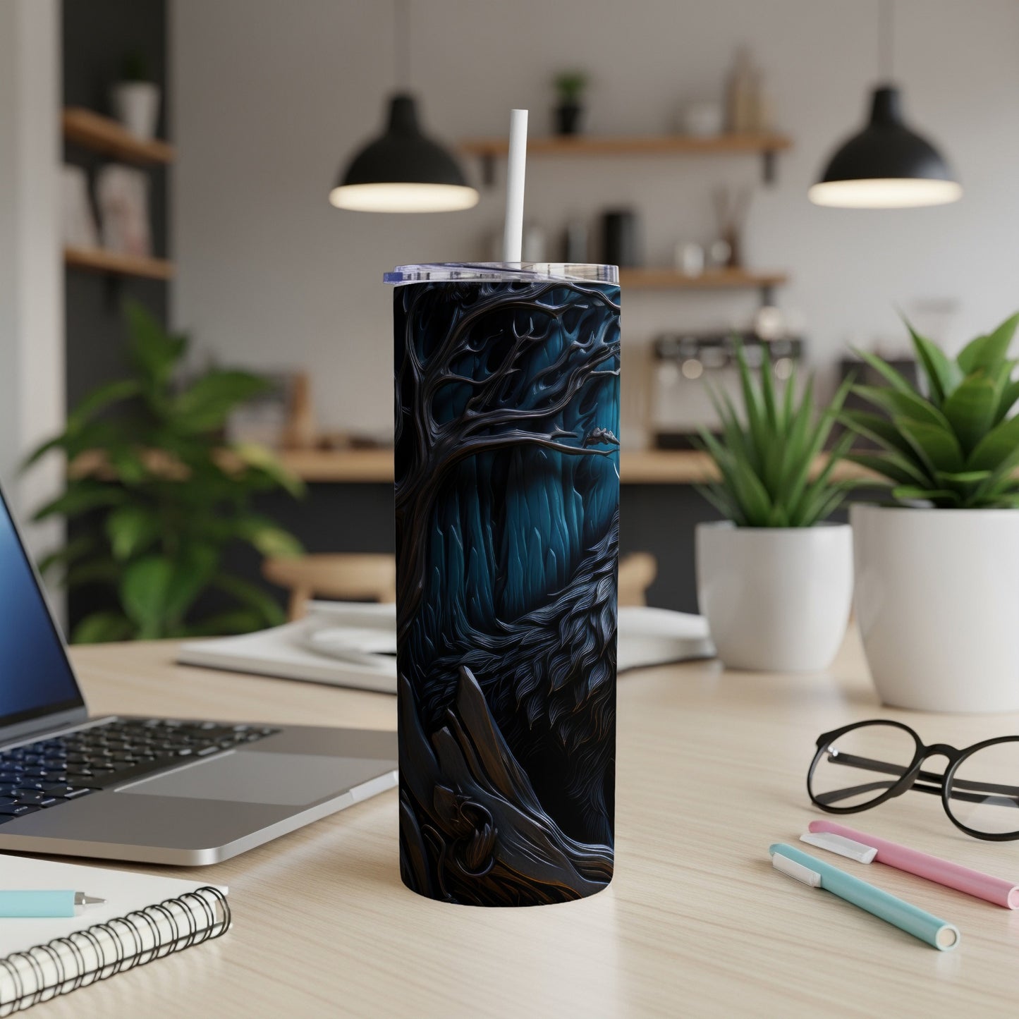 Tumbler with a dark, abstract forest design and a white straw.