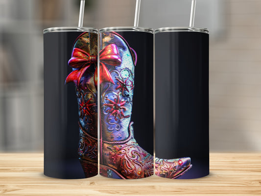 Tall tumbler featuring a richly decorated cowboy boot with a red bow.