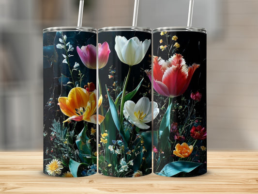 Three tumblers with colorful tulips and greenery on a dark background.