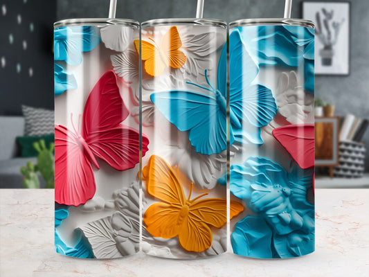 Three tumblers with raised butterfly designs in pink, blue, and orange.