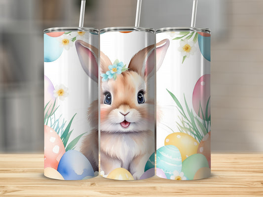 Watercolor bunny with Easter eggs and flowers on a tumbler.