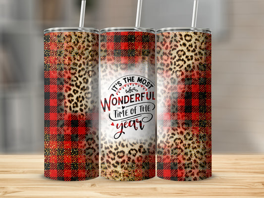 Christmas buffalo plaid and leopard print tumbler with "It's the most wonderful time of the year" text.