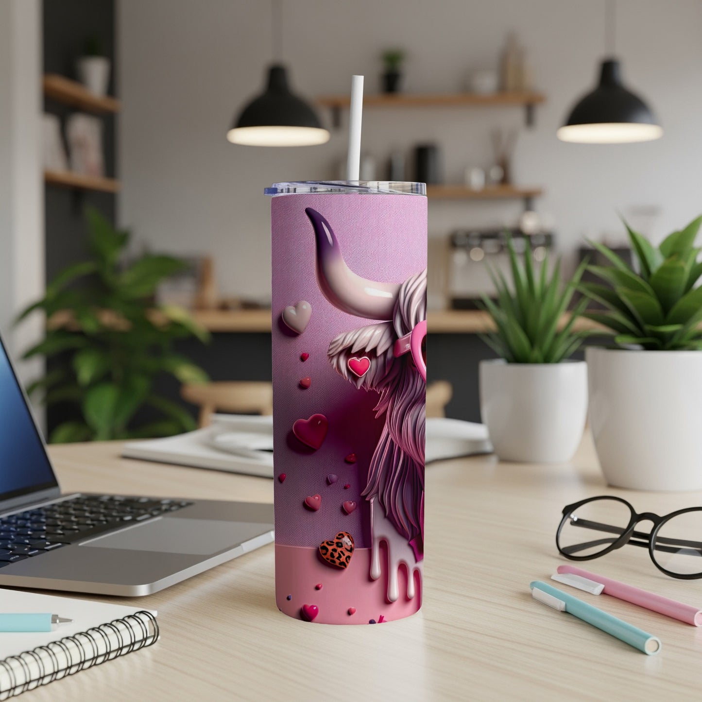 Pink tumbler with cow graphic, hearts, and hearts pattern.