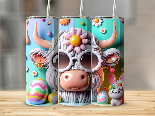 Three festive cow-themed tumblers with Easter eggs and floral accents.