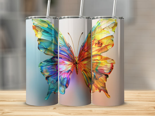 Three tumblers featuring a vibrant, stained-glass butterfly design.