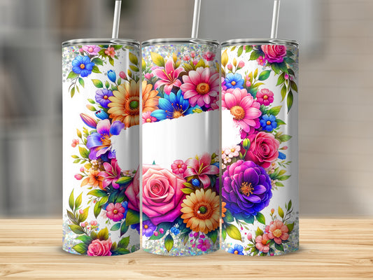 Three tumblers with floral designs and glitter accents.