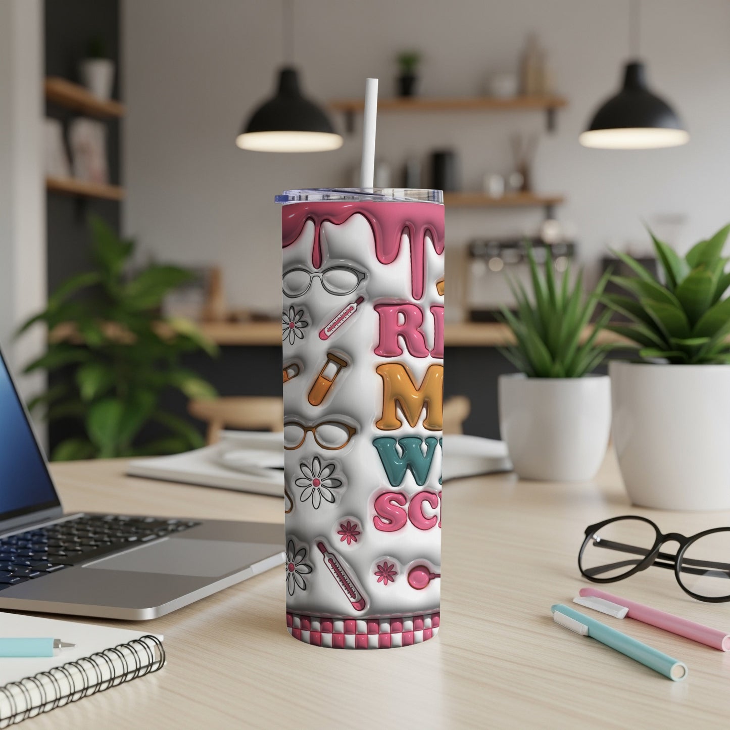 Tumbler with "RN M SCN" text and medical icons on a desk.