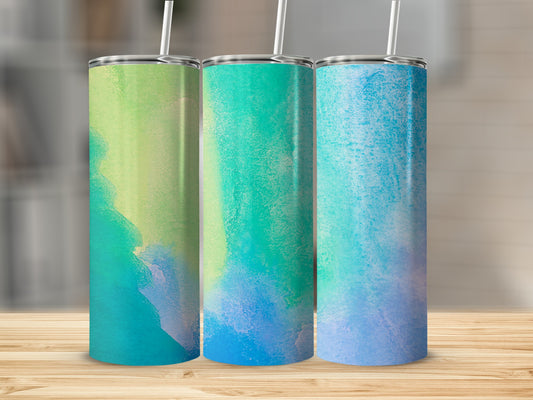 Three tumblers with colorful watercolor designs in green and blue.