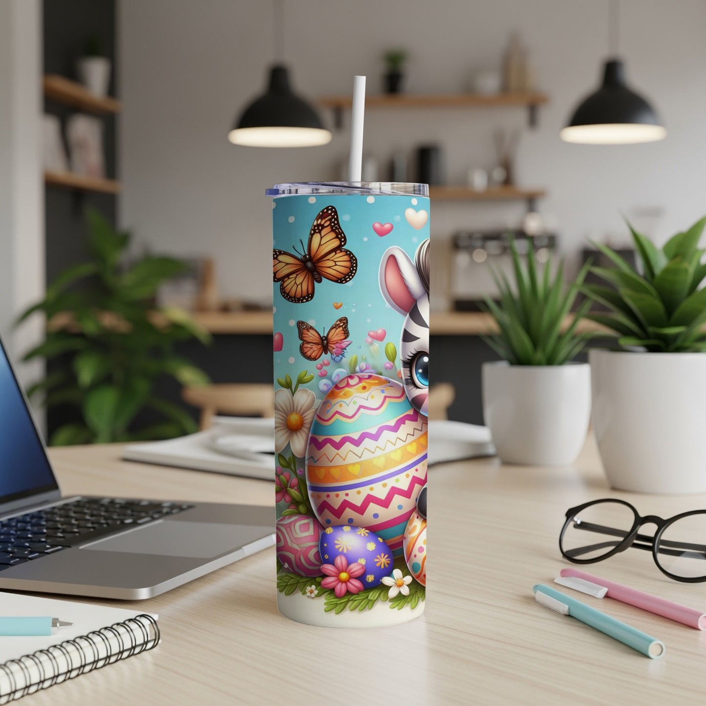 Easter tumbler with zebra, butterflies, and decorated eggs.