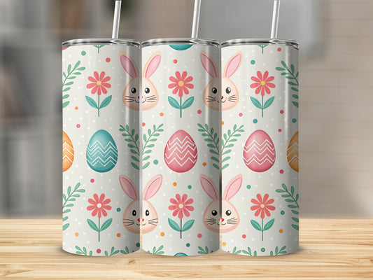 Three tumblers with pastel Easter bunny, flower, and egg pattern.