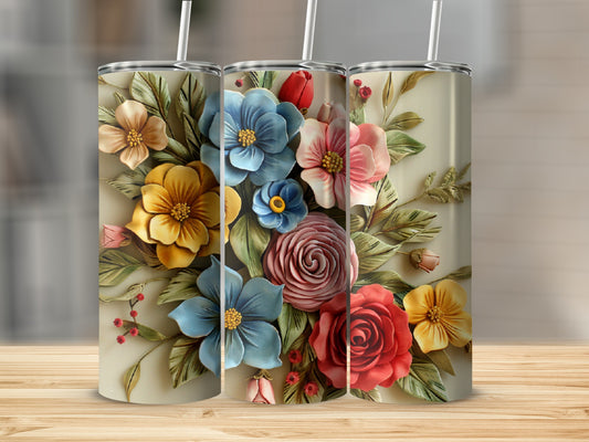 Three floral tumblers with textured floral designs and straws.