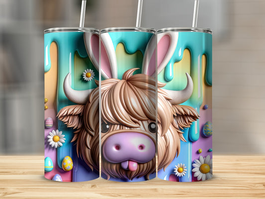 Highland cow with bunny ears and Easter eggs, presented on a tumbler.