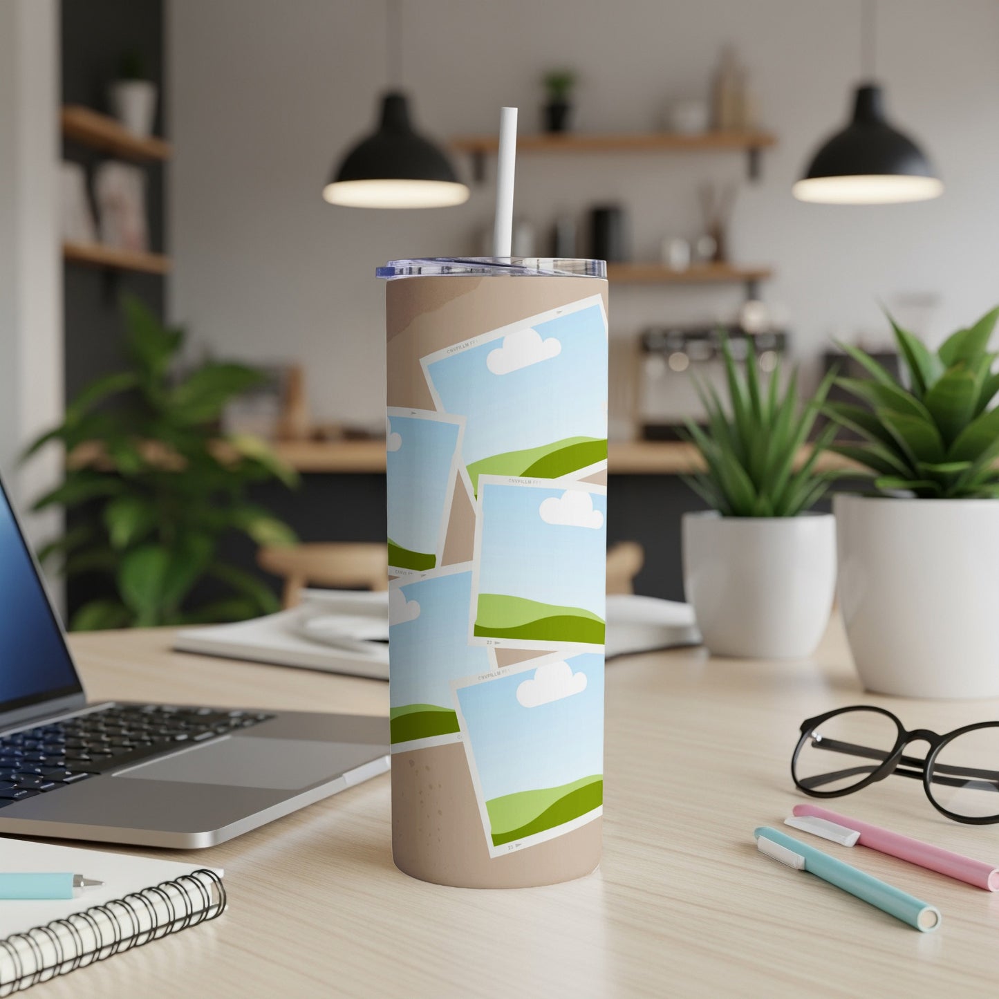 Tumbler with a pattern of overlapping photo frames featuring sky and rolling green hills.