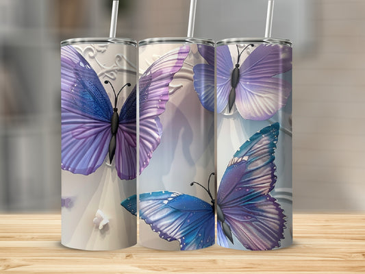 Three tall tumblers with purple and blue butterfly designs.