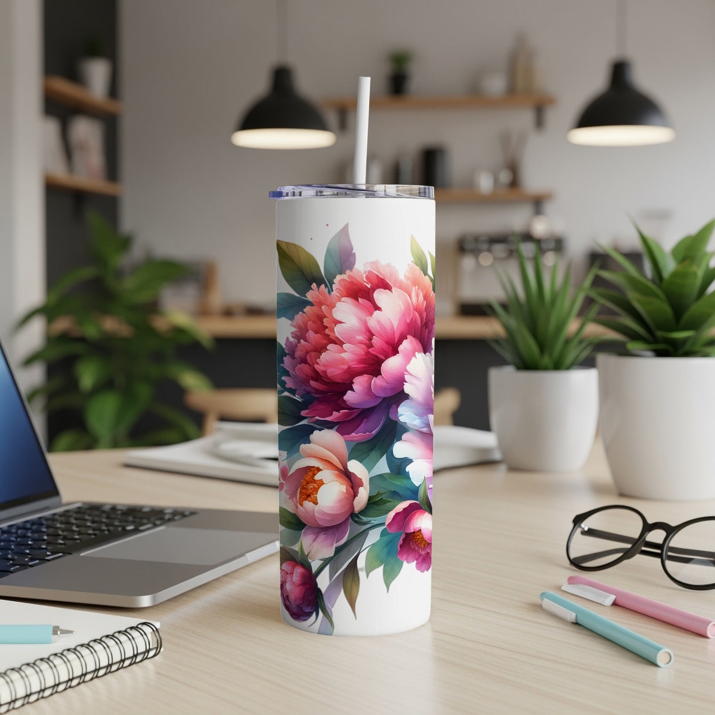 White tumbler with a vibrant pink and purple floral design.