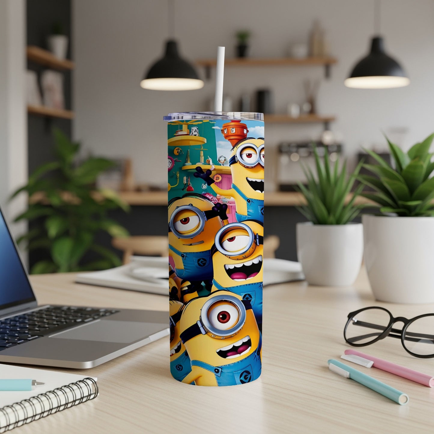 Minions characters on a tall, white travel tumbler with a straw.