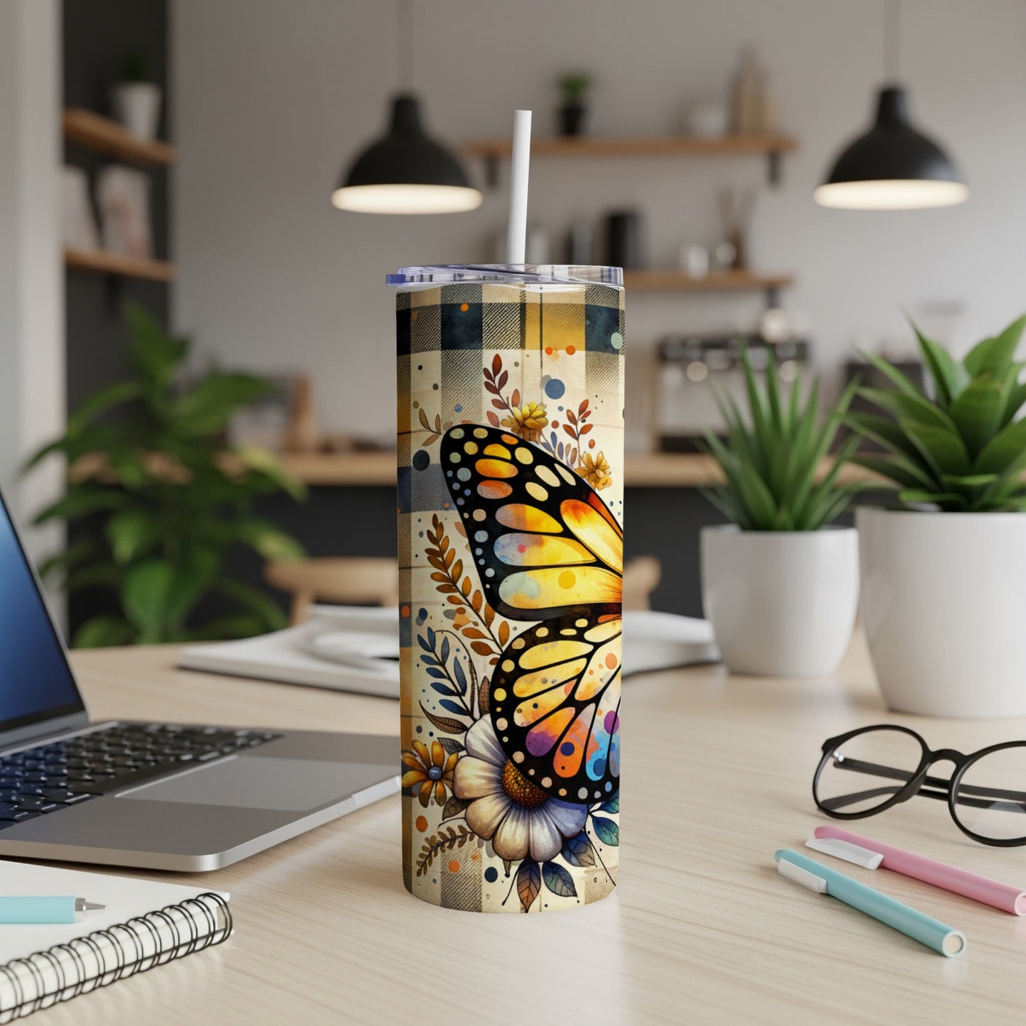 Yellow butterfly on a plaid tumbler with floral accents.