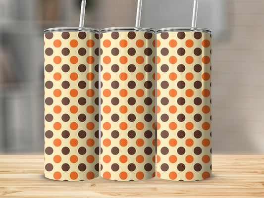 Three tumblers with a cream background and brown and orange polka dot pattern.
