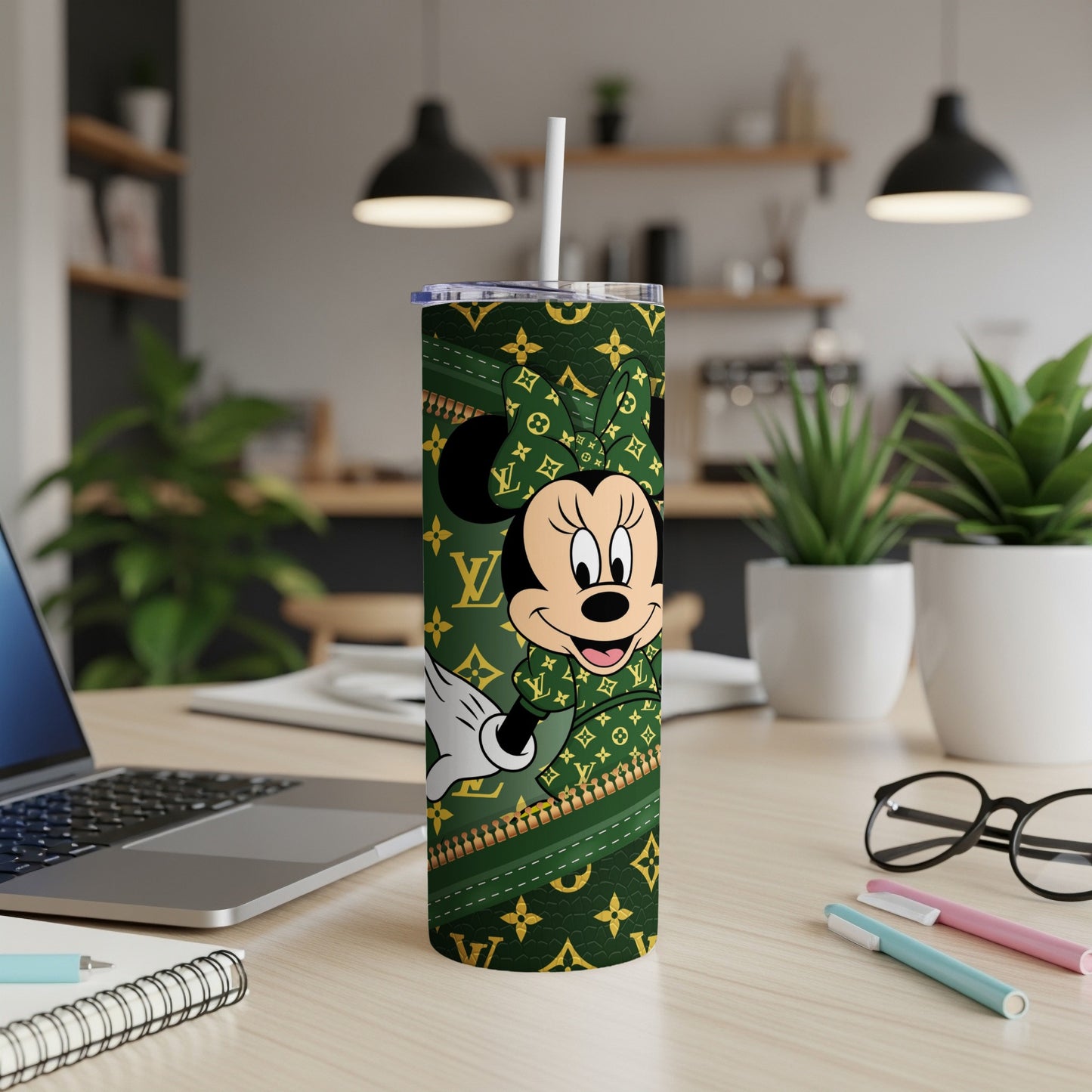 Minnie Mouse on a green tumbler with gold LV pattern.