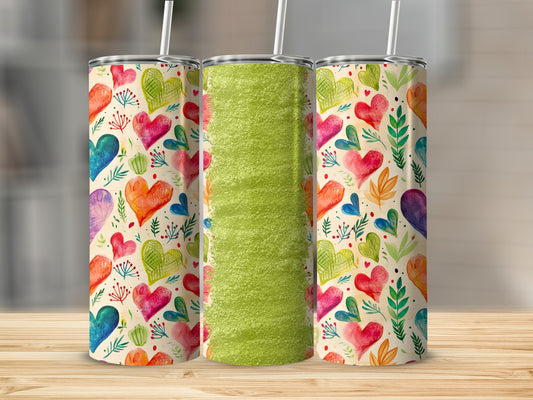Three tall tumblers with colorful heart pattern and textured green middle.