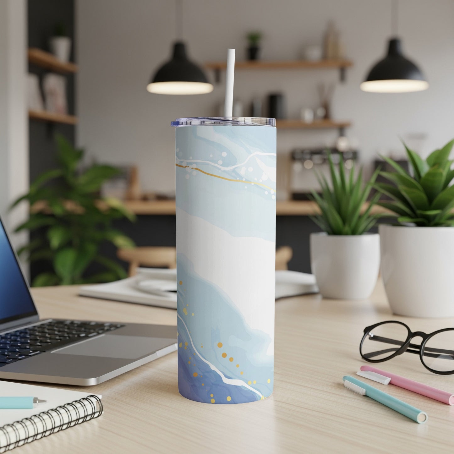 Tall, patterned tumbler with a blue, white, and gold abstract design.