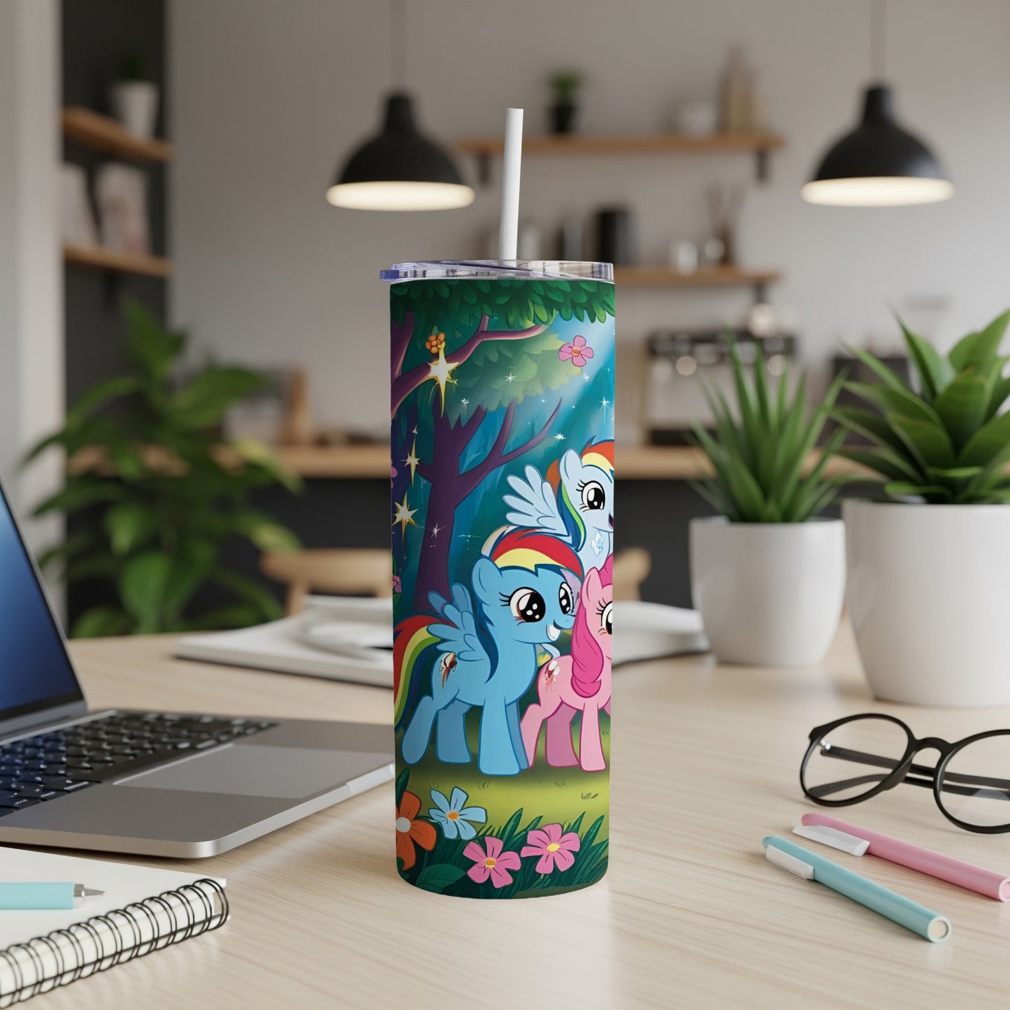 My Little Pony characters on a floral pattern tumbler with straw.