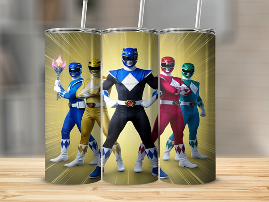 Three Power Rangers in colorful suits stand with fists clenched.