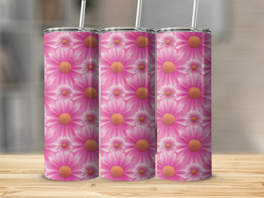 Three tumblers with pink daisy floral pattern on a wooden surface.