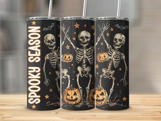 Black tumbler with skeletons, pumpkins, bats, and "Spooky Season" text.