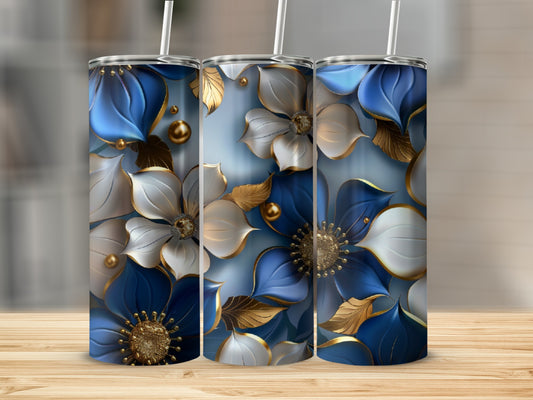 Three tumblers with blue and white floral designs and gold accents.