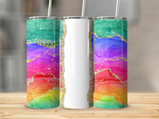 Tall tumbler with rainbow watercolor design and gold glitter accents.