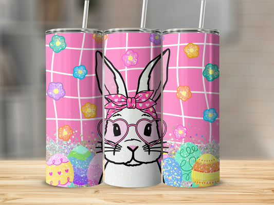 Easter bunny with pink glasses and colorful eggs on a pink grid background.