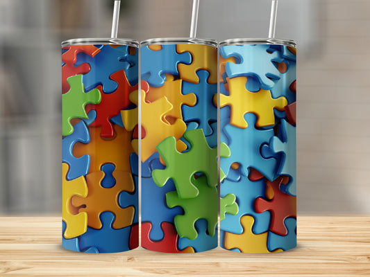 Three tumblers featuring colorful, interlocking puzzle pieces against a blurred background.