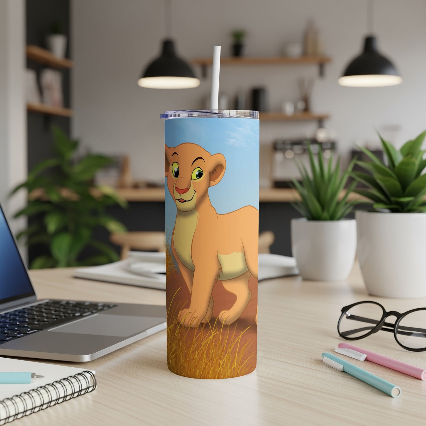 Nala from The Lion King on a tumbler with a straw.