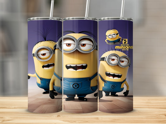 Three Minions from the movie "Minions" on a wooden surface.